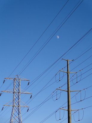 electric-power-lines-with-blue-sky-and-daytime-moon
